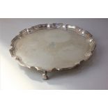 An Edward VIII silver salver with pie crust border, engraved monogram and presentation signatures,