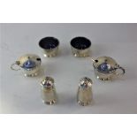 A George V silver six-piece cruet set of two salts, two mustard pots with blue glass liners and