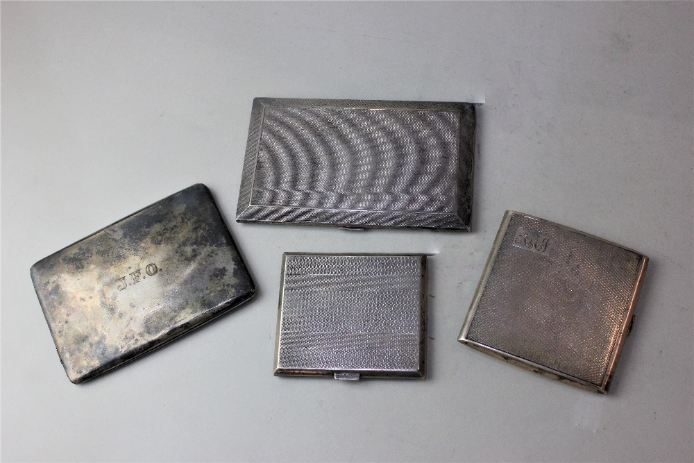 Three engine turned silver cigarette cases and another plain with inscriptions, 17.75oz