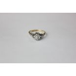 An illusion set diamond single stone ring, stamped '18CT PALL'