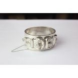 A Victorian silver clasp bracelet cast with a double buckled belt, engraved monogram, makers
