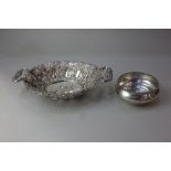 A Continental silver two handled pierced fruit bowl cast with fruiting vines and floral scroll