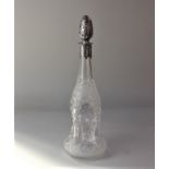 A Victorian silver mounted cut glass decanter waisted hourglass form with embossed silver collar and