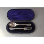 A cased Edward VII silver spoon and fork set with engraved monograms, maker Martin Hall & Co.