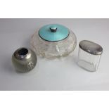 A George V silver and pale blue enamel lidded circular glass dressing table box, 17cm another silver