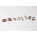A pair of ruby and pearl ear clips; a pair of paste ear clips; two pairs of pearl ear clips; a