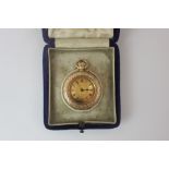 A Lady's 14k gold open face fob watch top wind with engraved foliate decoration in fitted case