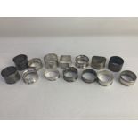 Fourteen 20th century silver napkin rings, various dates and makers, monogrammed, 7.1oz