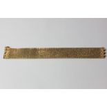 A 9ct gold textured link bracelet with slide clasp 59.2g