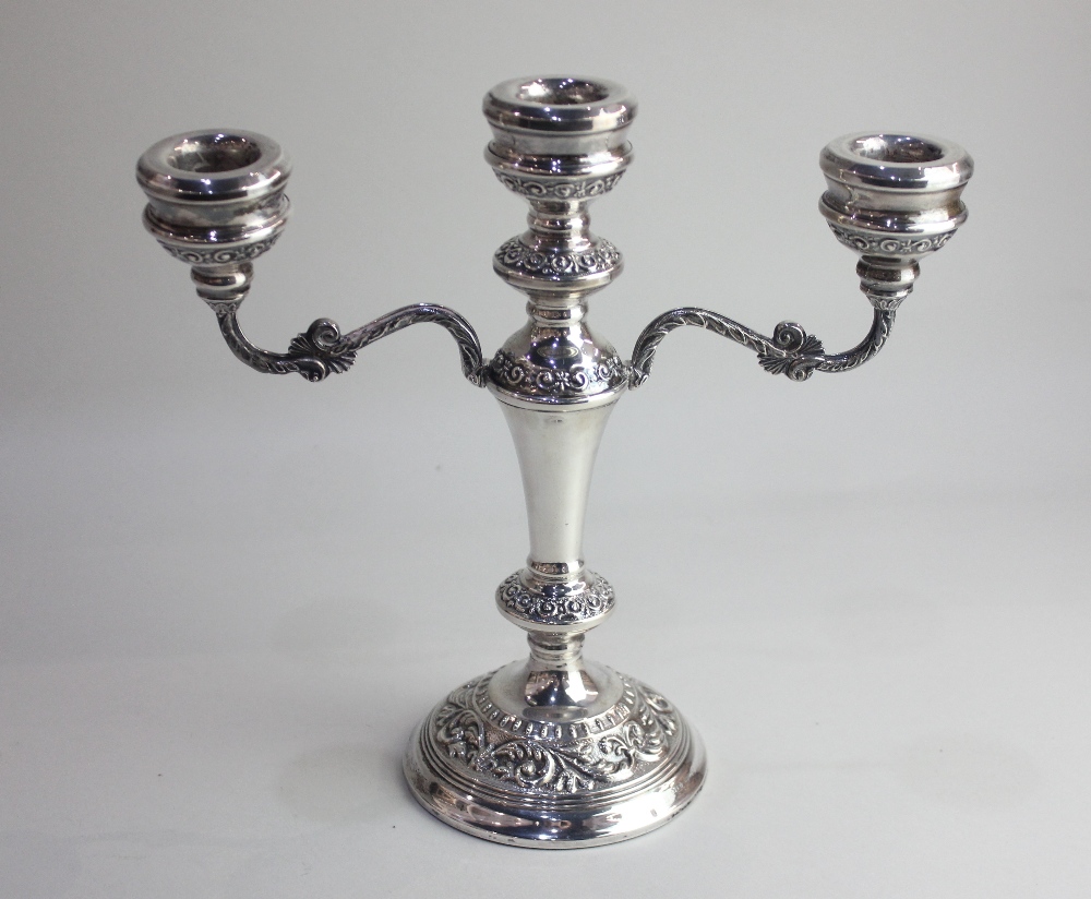 An Elizabeth II silver three branch Candelabra by W I Broadway & Co., hallmarked Birmingham, 1973,