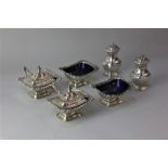 A matched six-piece George V silver cruet set of a pair of mustard pots, salt cruets and pepper pots