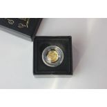 A 2009 gold half crown in magnified capsule and Fabula Aurum box