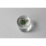 An emerald and diamond cluster ring in 18ct white gold (a/f)