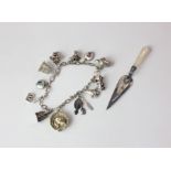 A silver charm bracelet and a novelty page marker