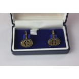 A pair of Halcyon Days blue and gilt enamel cufflinks oval shape decorated with urns and scrolls