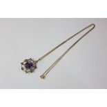 An Edwardian amethyst and seed pearl gold pendant with fine chain