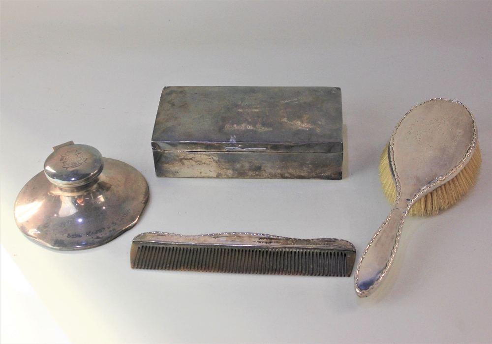 A George VI silver cigarette box, George V silver capstan inkwell, both with engraved