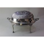 A silver plated two handled revolving oval domed tureen with fitted dish and liner, reeded top on