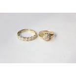 A gold seven stone diamond half eternity ring and an 18ct gold diamond cluster ring