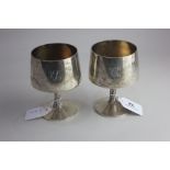 A pair of late 20th century silver goblets by Christopher Lawrence, gilt interiors on bark