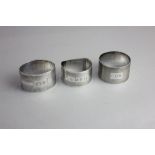 Three various silver serviette rings each with engraved initials 2.8oz