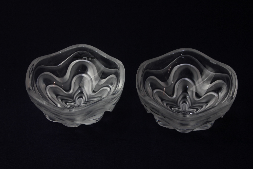 A Lalique clear crystal 'Vibration' box, of spherical form with repeat wave design, 11.5cm high when