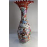 A large Japanese porcelain vase with flared frilly rim (a/f) and entwined serpent neck, decorated
