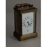 A French brass carriage clock with Roman numerals 15cm