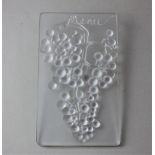 A R Lalique raisin muscat menu plaque, decorated in light relief with a bunch of hanging grapes,