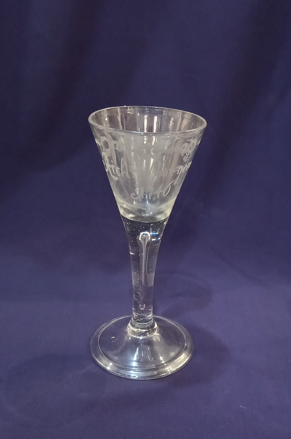 An 18th century style wine glass, the drawn funnel bowl engraved 'Rich Spurgeon 1746' on teared stem