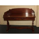 A Victorian mahogany dressing table with raised three quarter gallery, single centre drawer on