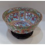 A Chinese Cantonese large famille rose porcelain bowl, decorated with panels of figural scenes,