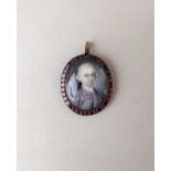 An 18th century miniature portrait of a gentleman wearing a purple coat and waistcoat, possibly by