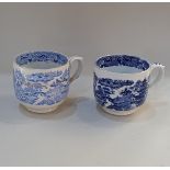 Two similar large blue and white cups with transfer printed Willow pattern style decoration, with
