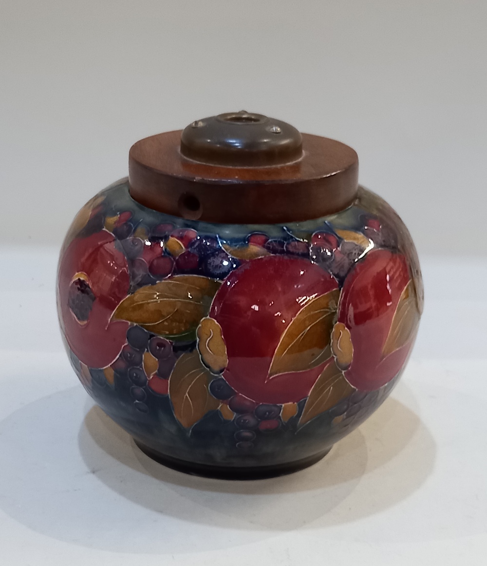 A Moorcroft pottery 'Pomegranate' pattern jar now converted to a lamp, 14.5cm high including fitting