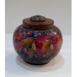 A Moorcroft pottery 'Pomegranate' pattern jar now converted to a lamp, 14.5cm high including fitting