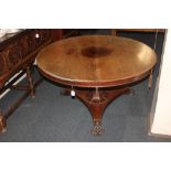 A 19th century mahogany breakfast table, the circular tilt top with column support, on incurved