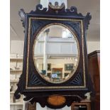 A George III style inlaid fret cut wall mirror oval bevel glass in rectangular frame with carved fan