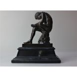 A late 19th century French bronze model of Spinario's young boy seated pulling a thorn from his