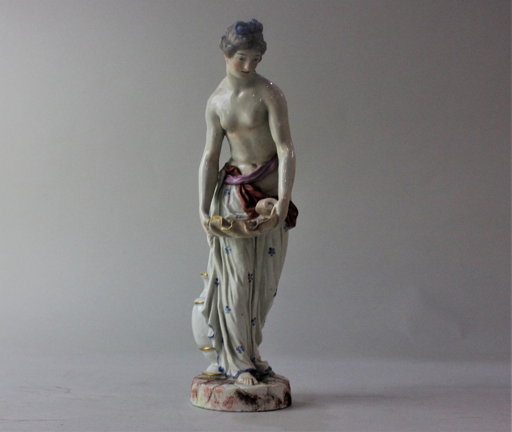 A Niderviller porcelain figure of a semi draped nude holding a shell, 23cm high