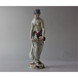 A Niderviller porcelain figure of a semi draped nude holding a shell, 23cm high