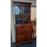 A 19th century mahogany secretaire bookcase top with twp glazed panel doors enclosing three