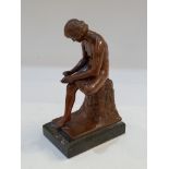 After the antique, a bronze study of 'Spinario', a seated boy removing a thorn from his foot, on