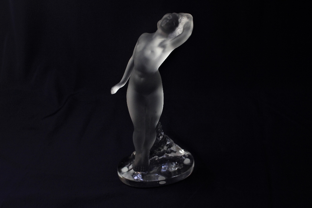 A Lalique crystal figure of a nude dancer with arm out, 23.5cm high