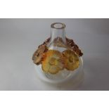 A Lalique 'Atossa' glass vase, with six raised amber coloured flowers, 20cm high