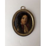 A 19th century portrait miniature of a gentleman, oval, 5.5cm by 4.5cm, in gilt metal frame