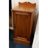 A Victorian satinwood bedside cupboard with single panelled door on plinth base (a/f) 38cm