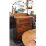 An Edwardian mahogany bow front dressing chest with chequered banding, oval adjustable mirror