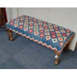 A tapestry upholstered rectangular long stool on block and turned legs, 105cm