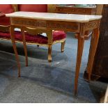 A Louis XV style side table with serpentine shaped marble top above gilt metal mounted frieze on